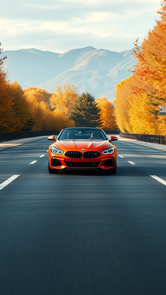Orange BMW Z4 on a road surrounded by autumn trees.